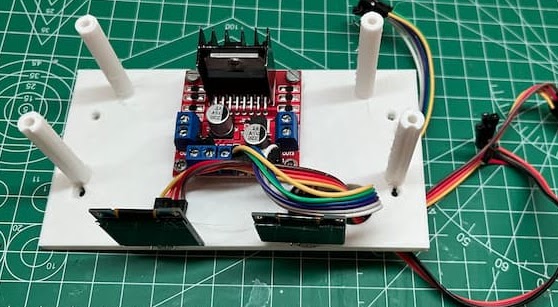 Two OLED displays glued to the front side of a 3D printed bracket